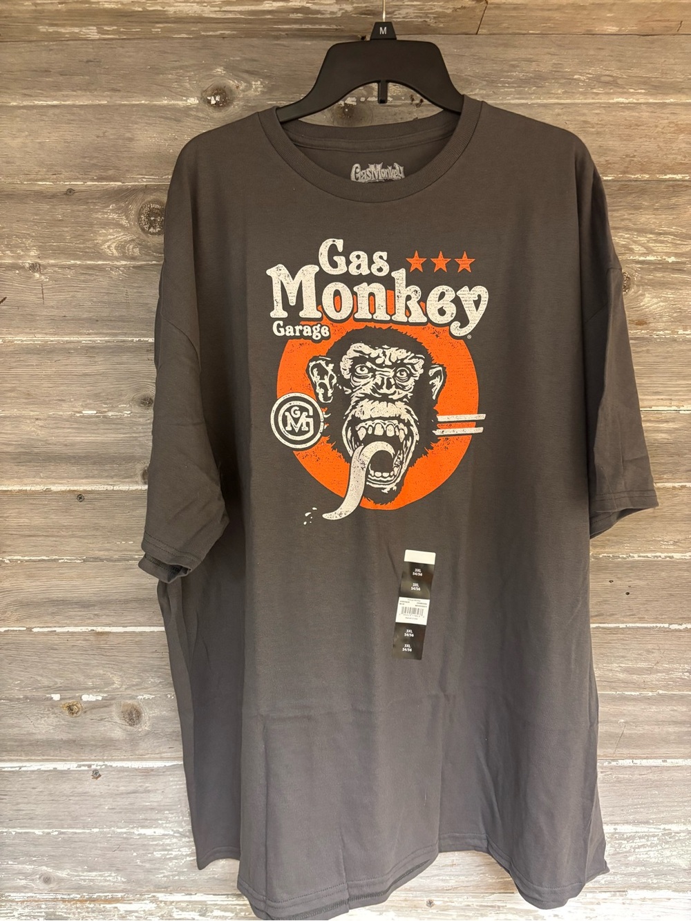 Gas Monkey Garage Men’s Short Sleeve Graphic Tee — Charcoal with Orange Accent
